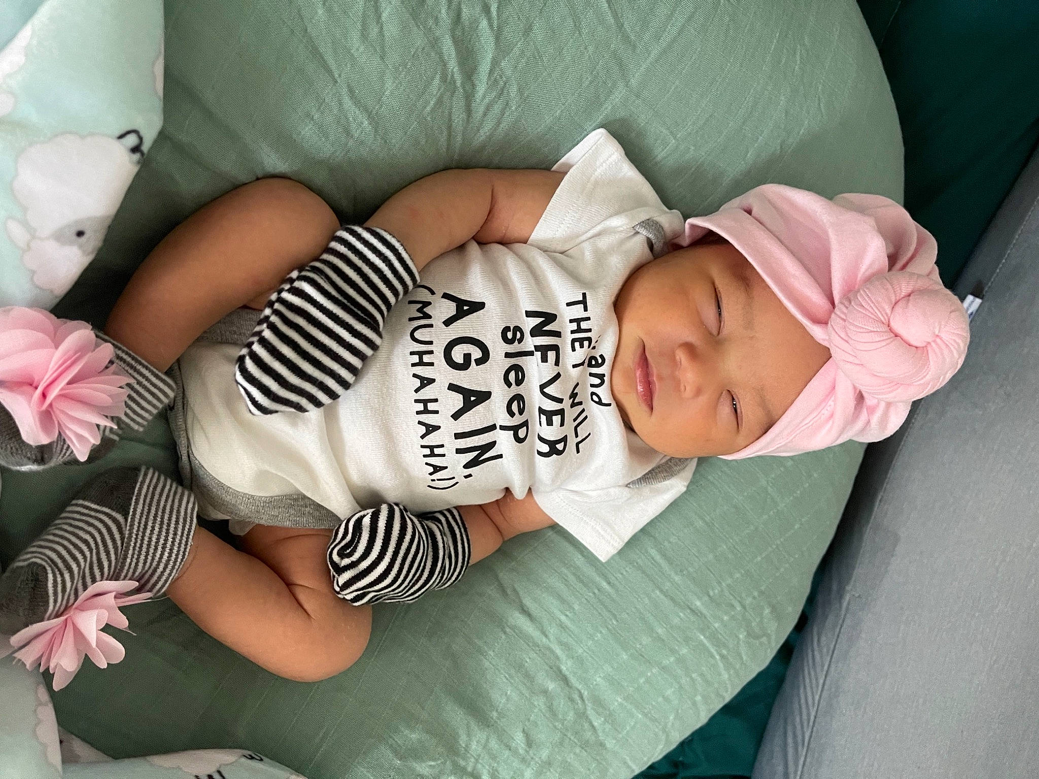 Lena is registered to the contest to win money with this photo: baby, baby_products, baby_toddler_clothing, cheek, child, comfort, cool, facial_expression, finger, hat, headwear, human_body, human_leg, knee, mouth, person, sitting, skin, sleeve, thigh