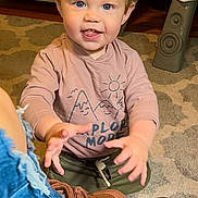 Knox joined the competition — help win amazing prizes! toddler, child, indoor, carpet, toy, shirt, pink_clothing, blue_eyes, happy, smiling, playing, hands, footwear, jeans, brown_shoes, furniture, wood_floor, hair, expression, person