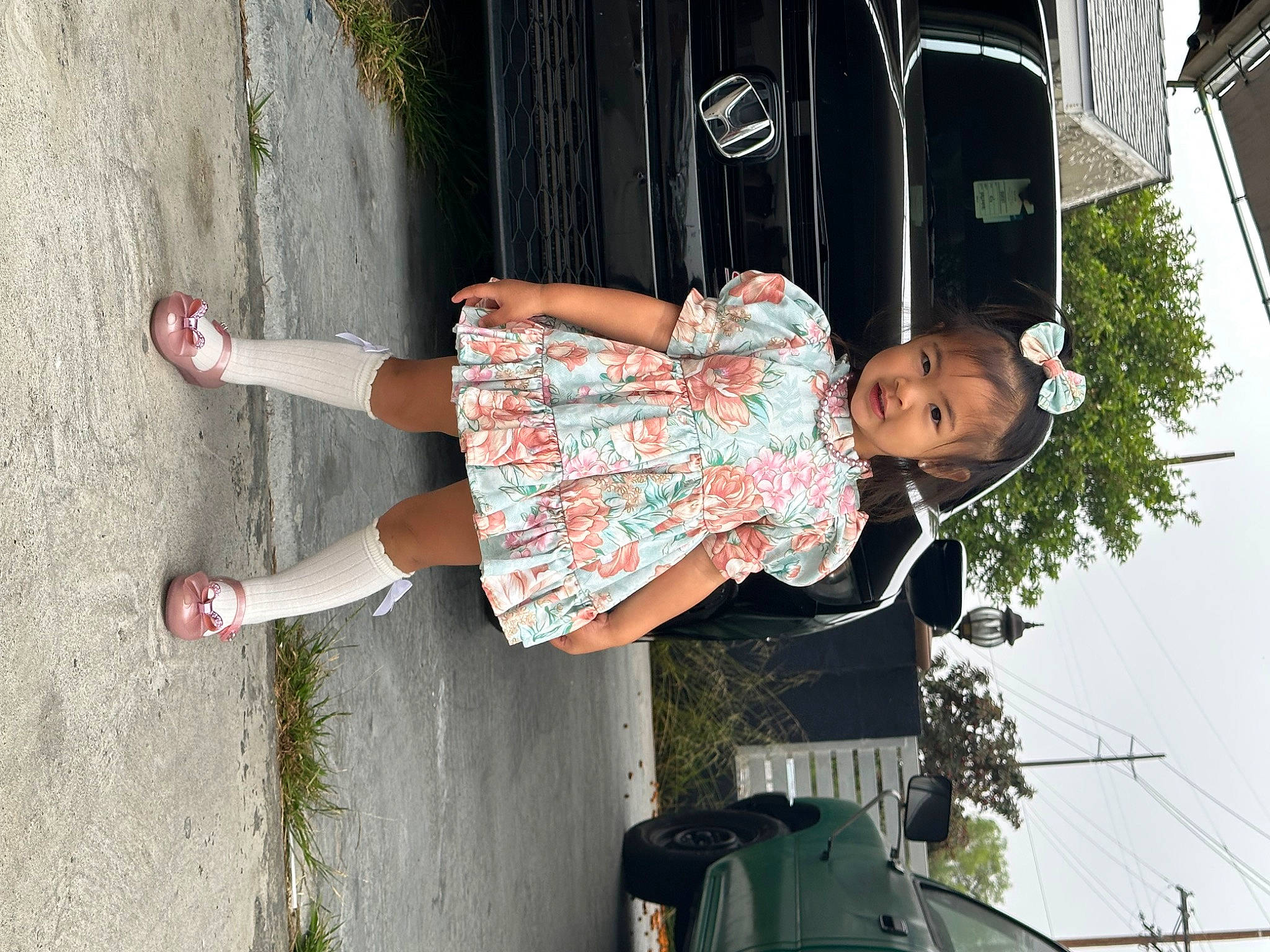 Nichole Love is registered to the contest to win money with this photo: car, day_dress, dress, fun, happy, human_leg, knee, leg, leisure, magenta, person, photograph, plant, recreation, sandal, snapshot, thigh, tints_and_shades, toddler, tree