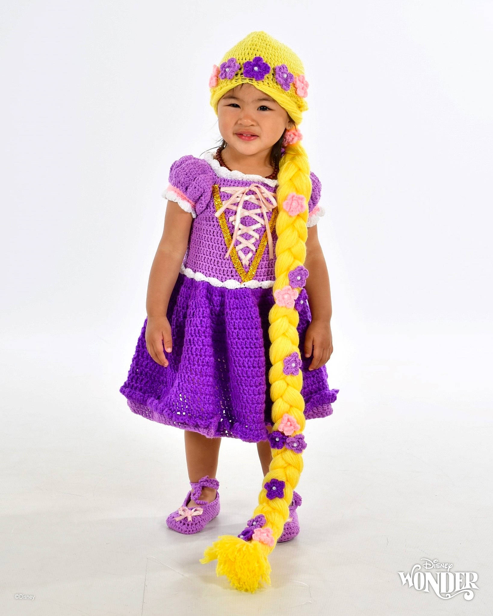 Nichole Love is registered to the contest to win money with this photo: arm, baby_toddler_clothing, cap, costume_hat, dress, electric_blue, event, fashion_accessory, fashion_design, happy, headgear, headwear, magenta, one_piece_garment, pattern, person, purple, sleeve, toddler, violet