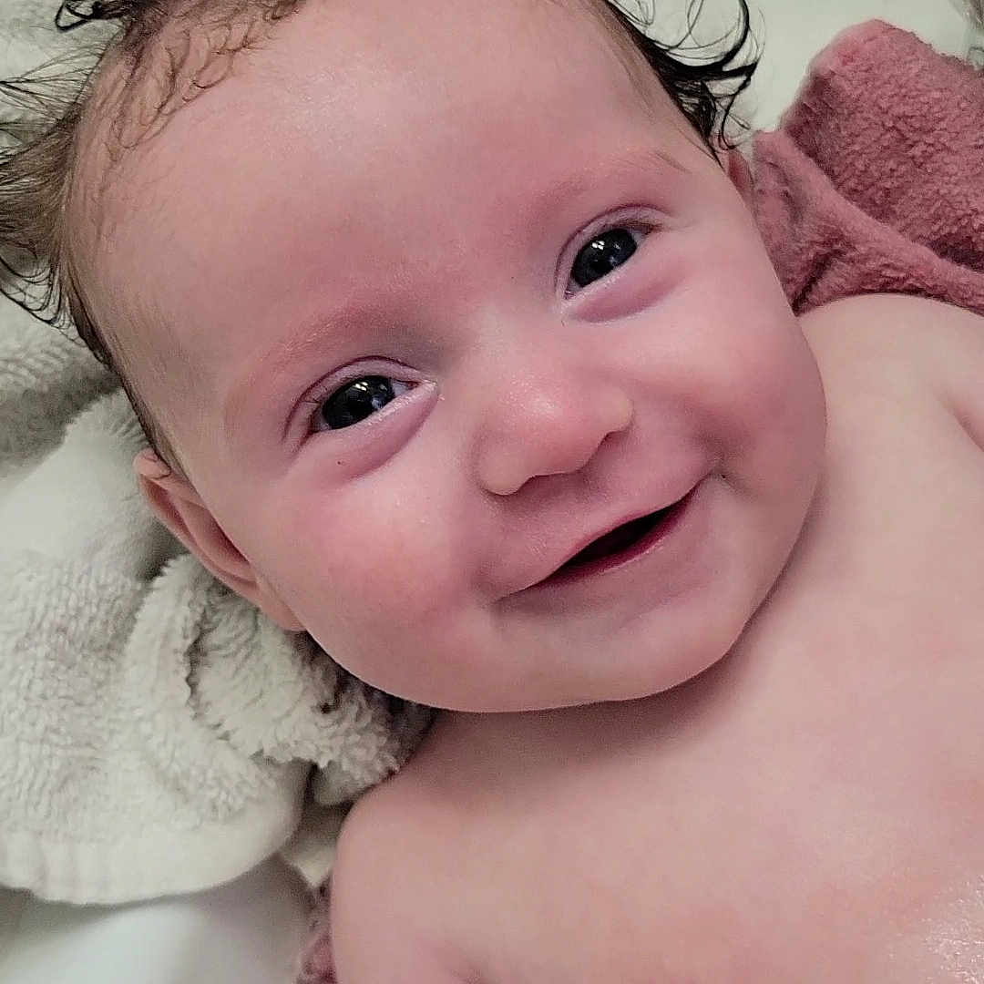 Marlee joined the competition — help win amazing prizes! architecture, baby, bathing, bathtub, bodypart, building, face, happy, head, indoors, laughing, mouth, newborn, person, photography, portrait, smile, teeth, towel, tub