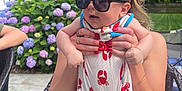 Miller joined the competition — help win amazing prizes! baby, sunglasses, woman, hands, red_nails, romper, crab_pattern, outdoor, garden, hydrangea, flowers, greenery, chair, patio, person, summer, cute, fashion, child, sunny