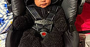 Kisen joined the competition — help win amazing prizes! baby, child, car_seat, black_clothing, hooded_jacket, straps, blanket, red_background, cute, infant, face, seat_belt, indoor, soft_texture, warm_clothing, looking_at_camera, portrait, cozy, young_child, smiling