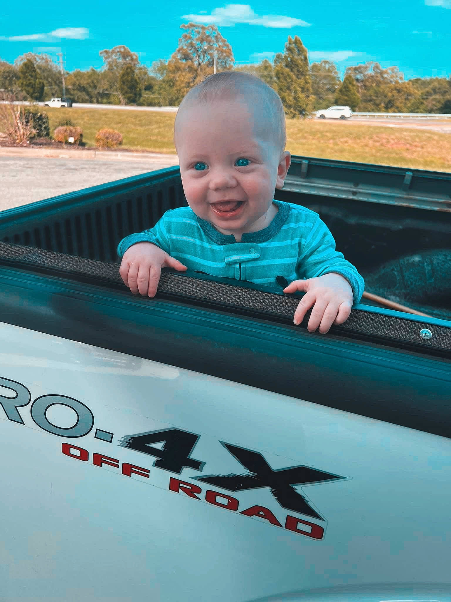 Oliver joined the competition — help win amazing prizes! automotive_design, automotive_exterior, baby_toddler_clothing, blue, bumper, cloud, happy, hood, joy, leisure, motor_vehicle, person, personal_luxury_car, recreation, sky, smile, t_shirt, toddler, travel, vehicle