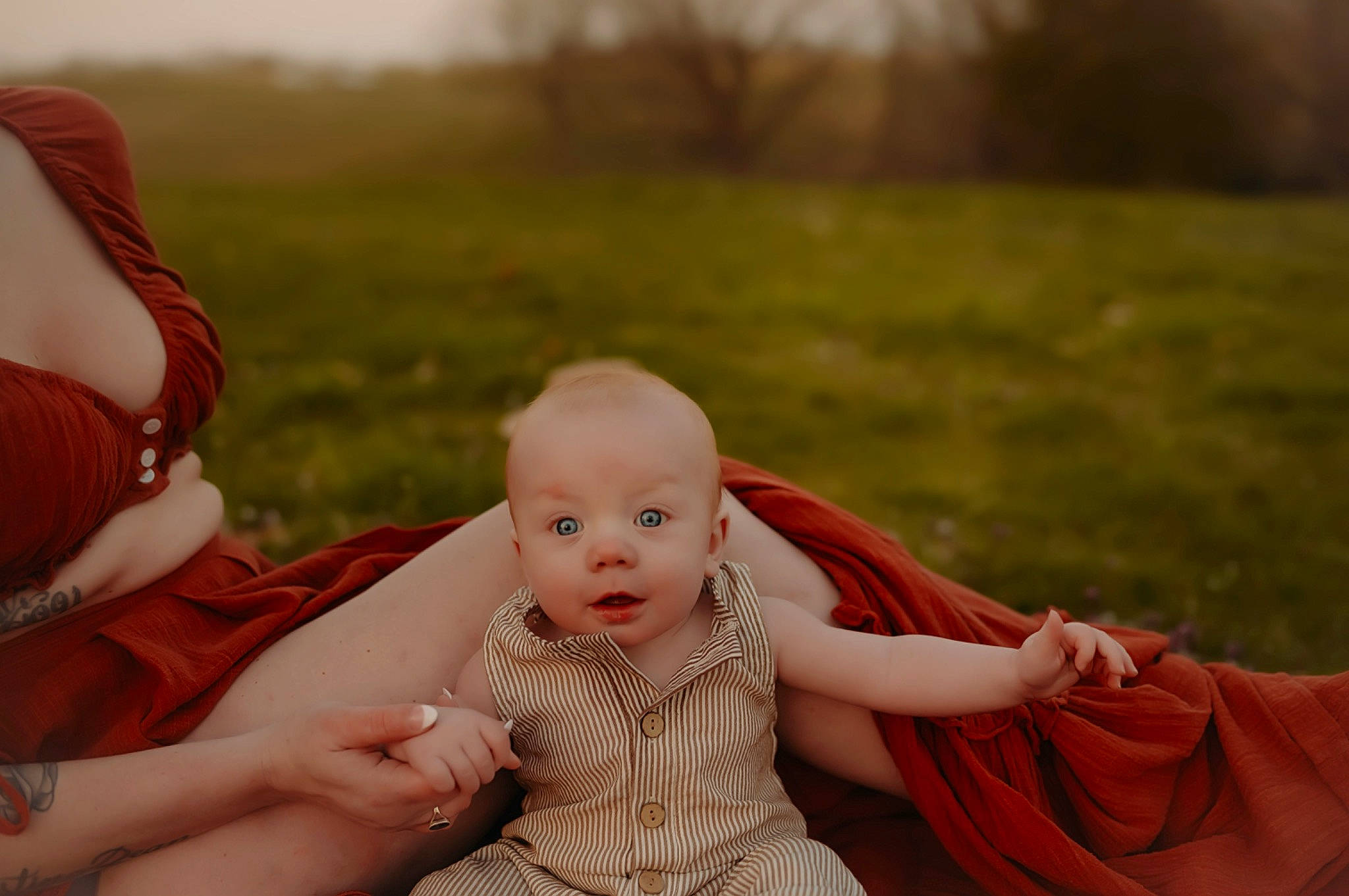 Oliver is registered to the contest to win money with this photo: baby, baby_toddler_clothing, child, flash_photography, fun, fur, gesture, grass, grassland, happy, jewellery, leisure, love, people_in_nature, person, portrait_photography, prairie, sitting, skin, toddler
