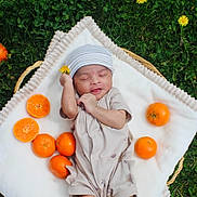 Rudra joined the competition — help win amazing prizes! newborn, baby, blanket, grass, tangerine, orange, flower, hat, clothing, nature, outdoor, infant, cute, sleeping, basket, soft, peaceful, green, fresh, fruit