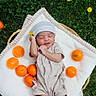 newborn, baby, blanket, grass, tangerine, orange, flower, hat, clothing, nature, outdoor, infant, cute, sleeping, basket, soft, peaceful, green, fresh, fruit