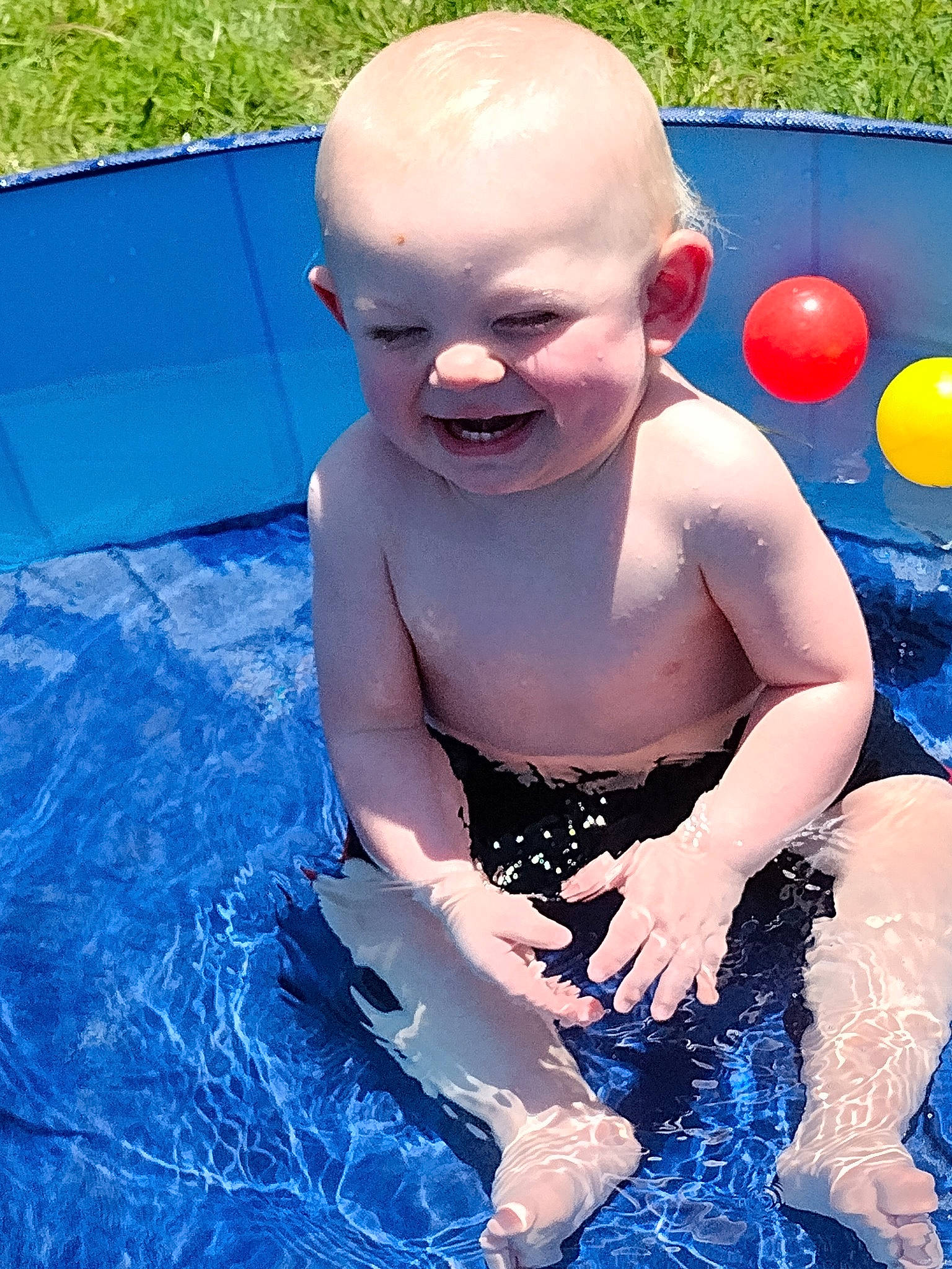 Zachary joined the competition — help win amazing prizes! baby, balloon, barechested, blue, chest, child, electric_blue, fun, grass, happy, head, human_body, joy, leisure, person, recreation, sitting, smile, swimming_pool, toddler