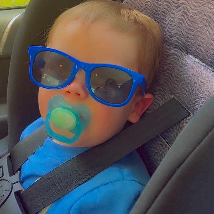 Noah joined the competition — help win amazing prizes! baby, blue_shirt, car, car_seat, casual, child, child_seat, cute, indoor, pacifier, portrait, reflection, relaxed, safety, seatbelt, sunglasses, toddler, travel, window, young_child
