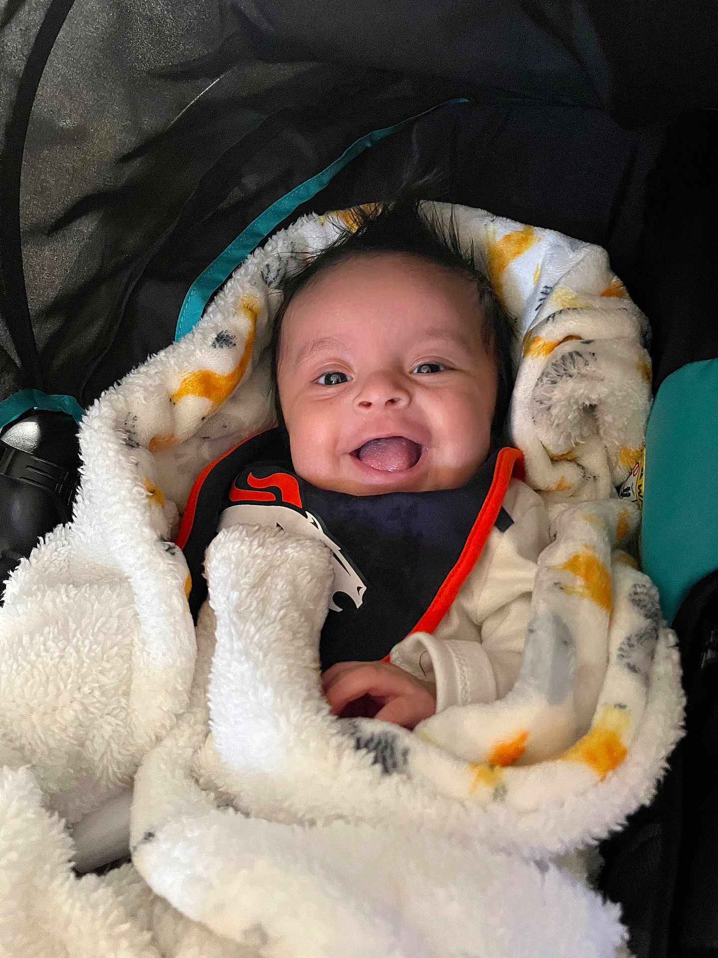 Leonard joined the competition — help win amazing prizes! baby, smiling, blanket, bib, cozy, infant, happy, face, cute, child, clothing, portrait, warm, soft, wrapped, sitting, indoor, expression, person, head