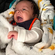 Leonard joined the competition — help win amazing prizes! baby, infant, blanket, clothing, face, hand, person, portrait, cute, expression, newborn, soft, warm, indoor, child, sleepwear, cozy, young, adorable, wrapped