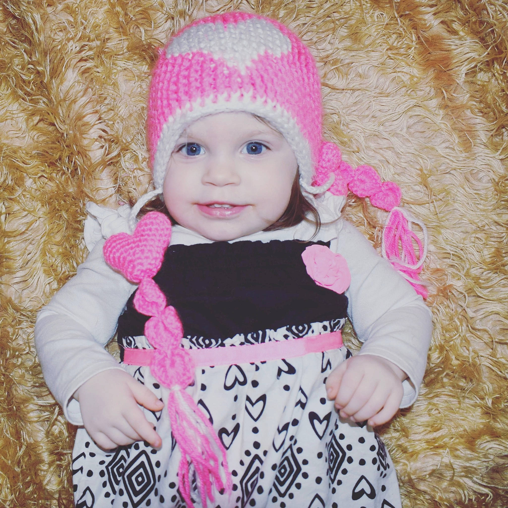 Luella joined the competition — help win amazing prizes! baby, beanie, beauty, cheek, child, cool, crochet, eye, face, fun, head, headgear, knit_cap, lip, person, pink, product, skin, smile, toddler