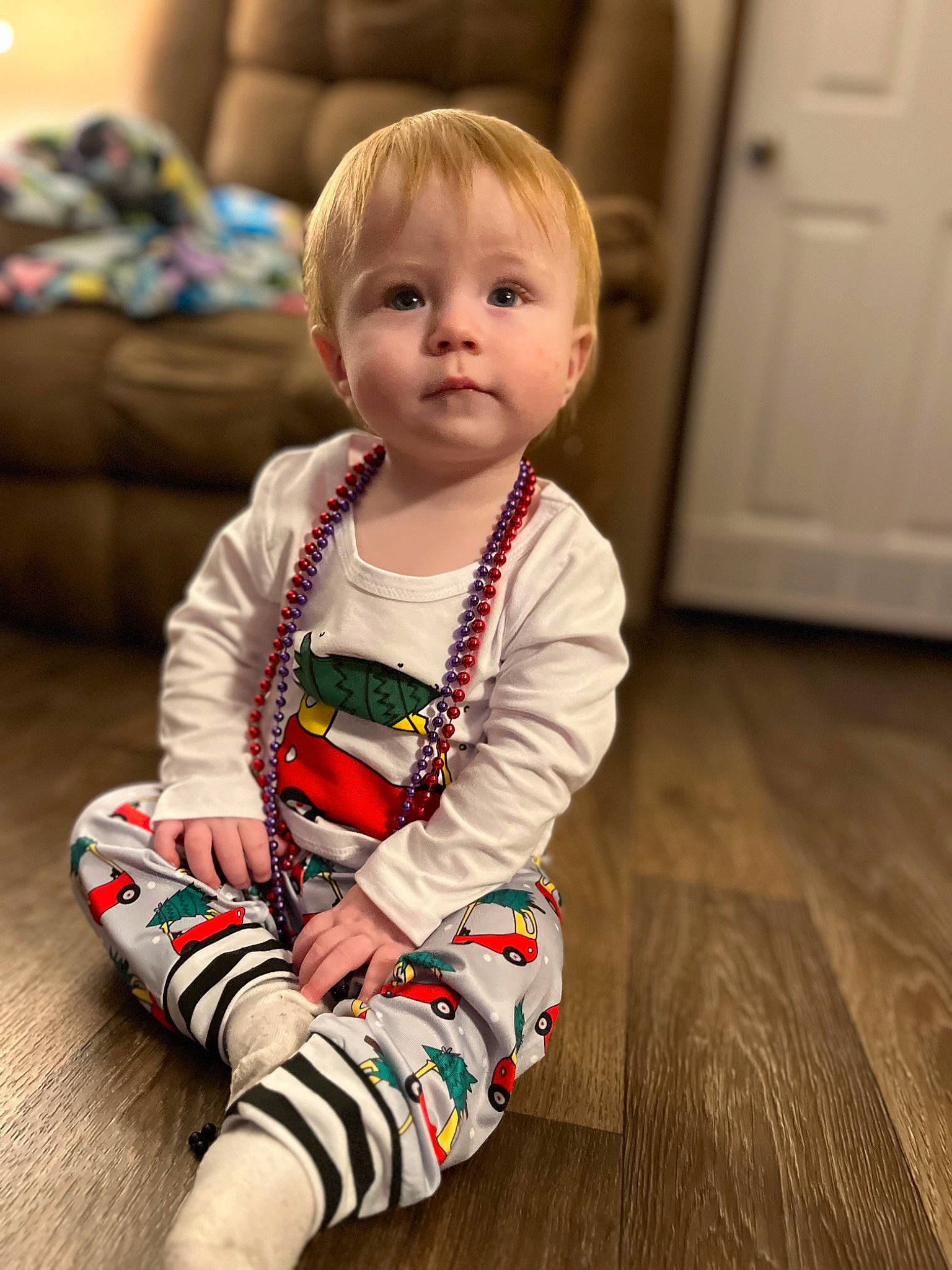 Rylan joined the competition — help win amazing prizes! baby, baby_toddler_clothing, cheek, child, comfort, door, dress, event, face, floor, flooring, happy, hardwood, head, light_switch, person, sitting, skin, sleeve, toddler