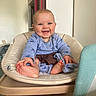 baby, smiling, blue_clothing, chair, cushion, indoor, child, happy, person, furniture, feet, head, skin, room, home, cute, portrait, infant, laughing, cozy