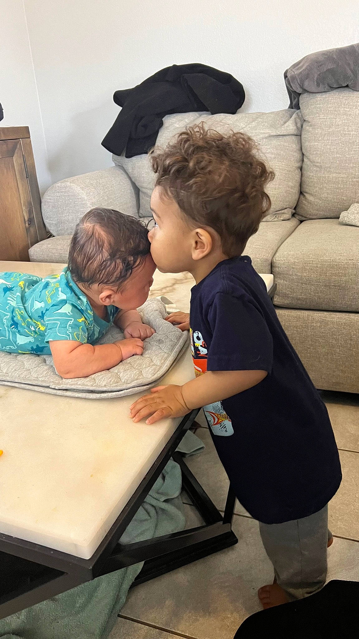 Kaiden joined the competition — help win amazing prizes! baby, child, comfort, flooring, fun, gesture, happy, lamp, leisure, person, room, sitting, t_shirt, table, throw_pillow, toddler, umbrella, visual_arts