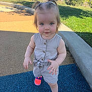 Remie joined the competition — help win amazing prizes! toddler, child, girl, standing, portrait, pigtails, smiling, playground, outdoor, sunny, romper, overalls, buttons, neon_shoes, sneakers, suburban, sidewalk, grass, residential, daylight
