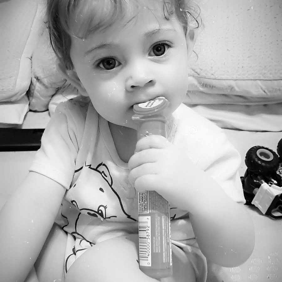 Meadow joined the competition — help win amazing prizes! baby, black_and_white, candy, child, clothing, curly_hair, cushion, cute, expression, face, floor, hand, heart_emoji, indoors, pacifier, play, portrait, sitting, toddler, toy