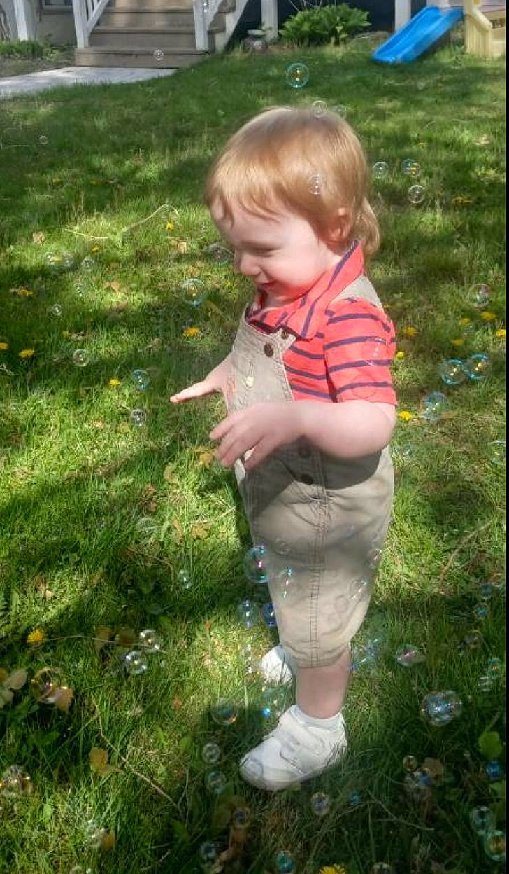 Finnegan joined the competition — help win amazing prizes! baby, baby_toddler_clothing, barefoot, botany, child, fun, garden, grass, grass_family, grassland, groundcover, happy, lawn, leaf, pattern, people_in_nature, person, play, sitting, toddler
