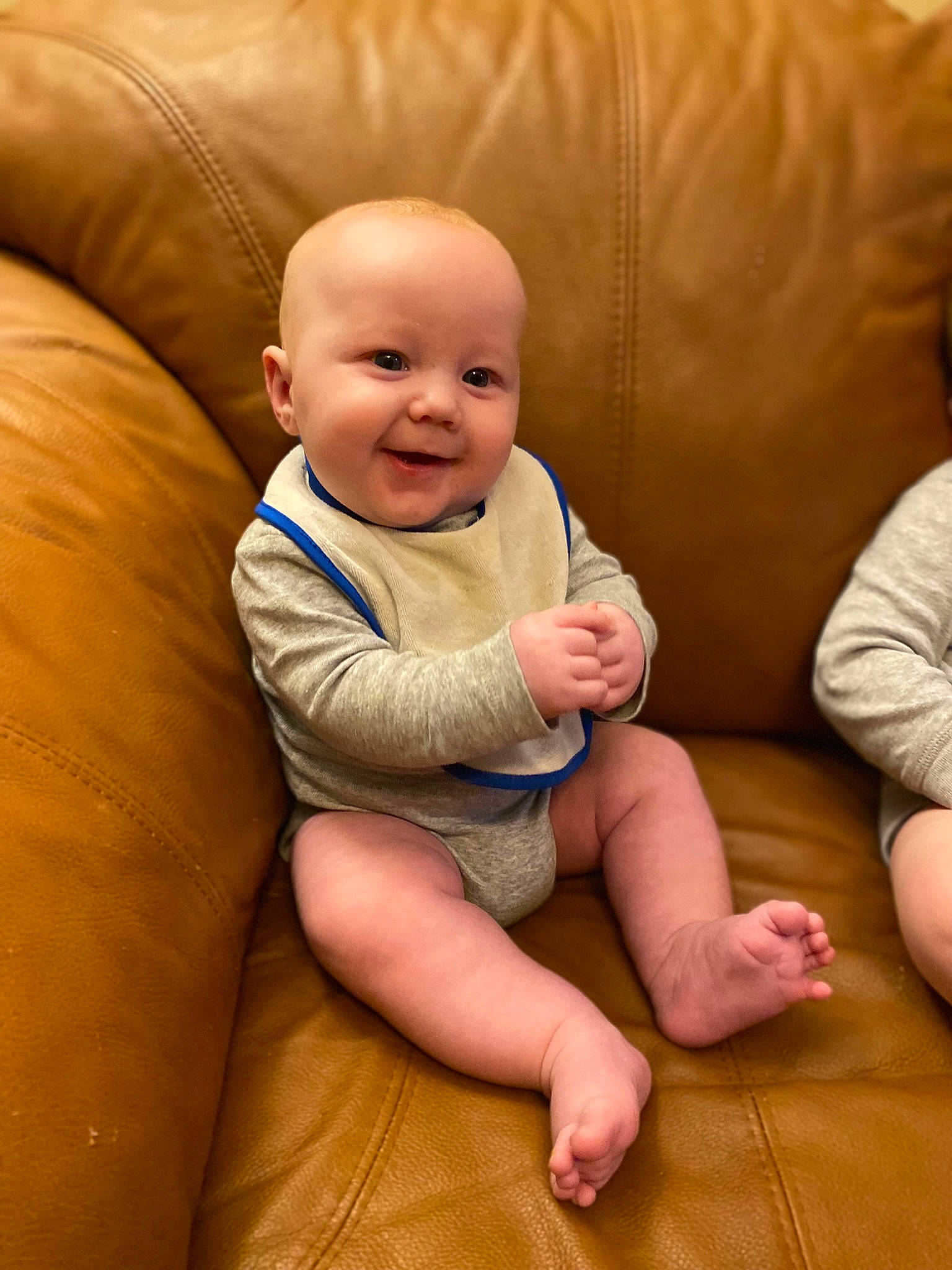 Wyatt is registered to the contest to win money with this photo: arm, baby, baby_toddler_clothing, cheek, chin, comfort, eye, face, flooring, gesture, human_body, joint, joy, mammal, mouth, muscle, nose, person, skin, smile