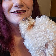 Ozzy joined the competition — help win amazing prizes! woman, dog, pet, smile, affection, indoor, curly_hair, red_hair, white_dog, closeup, friendship, love, portrait, happy, face, human, animal, cute, cozy, hair