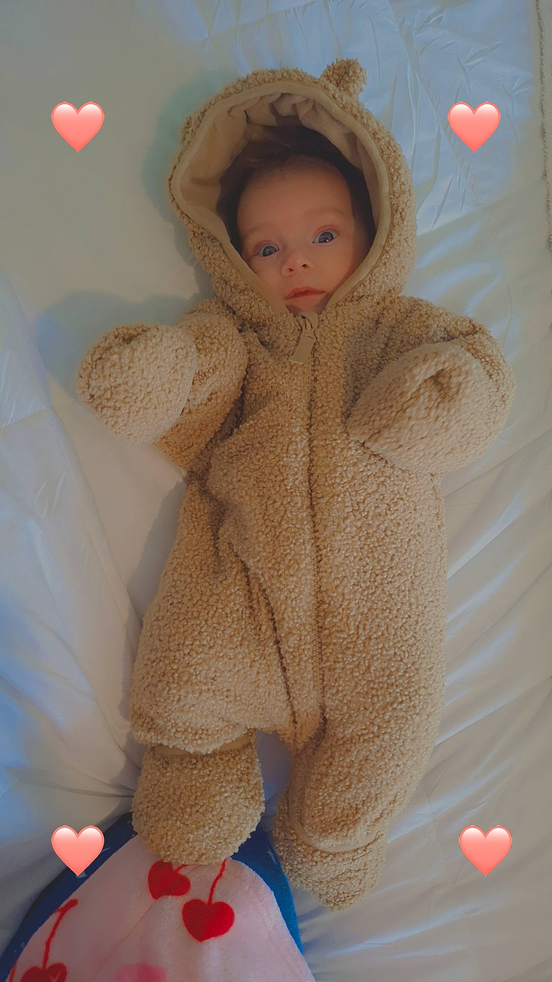 Larry is registered to the contest to win money with this photo: adorable, baby, bear_ears, bed, blanket, child, cozy, cute, fuzzy_clothing, heart_emoji, indoor, infant, infant_face, lying_down, newborn, onesie, pink_hearts, sleepwear, soft_texture, warm_clothing