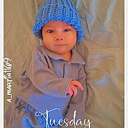 Larry joined the competition — help win amazing prizes! baby, infant, blue_hat, pom_pom, pajamas, bed, bedding, blanket, lying_down, portrait, cute, child, face, skin, sleepwear, indoors, soft_lighting, time_stamp, watermark, calm