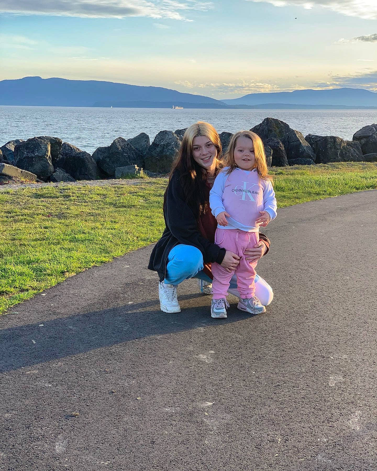 Calliope joined the competition — help win amazing prizes! cloud, ecoregion, electric_blue, footwear, fun, grass, grassland, happy, joy, landscape, leisure, mammal, mountainous_landforms, natural_environment, people_in_nature, person, shoe, sky, sneakers, toddler