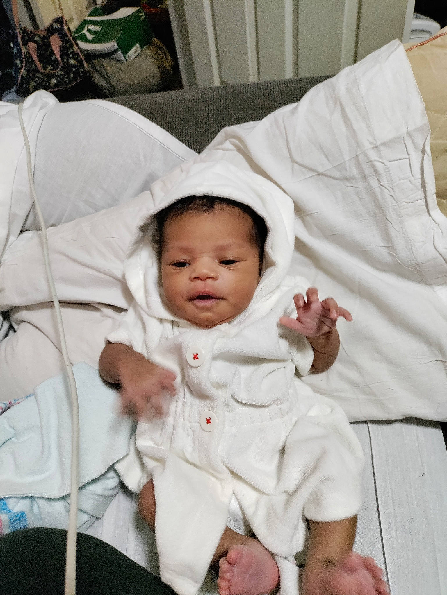 Tory is registered to the contest to win money with this photo: baby, baby_products, baby_safety, baby_sleeping, baby_toddler_clothing, cheek, child, comfort, event, fun, gesture, happy, linens, person, room, sitting, sleeve, smile, thumb, toddler