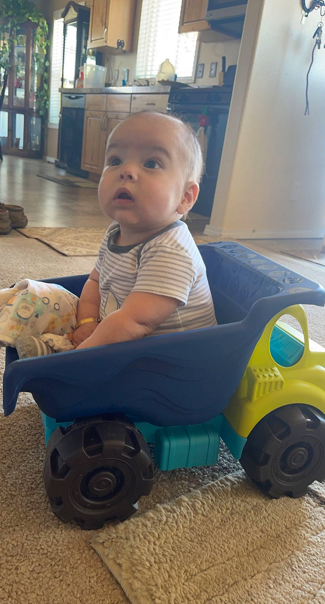 Martin joined the competition — help win amazing prizes! automotive_design, automotive_tire, automotive_wheel_system, baby, baby_toddler_clothing, child, electric_blue, flooring, fun, person, plastic, riding_toy, sitting, surprise, tire, toddler, toy, toy_vehicle, tread, vehicle