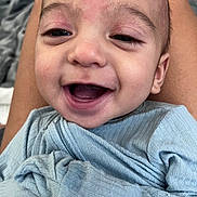 Matteo joined the competition — help win amazing prizes! baby, smiling, face, infant, clothing, blue, person, happy, closeup, skin, eyes, mouth, head, lap, texture, blanket, fabric, comfort, expression, child