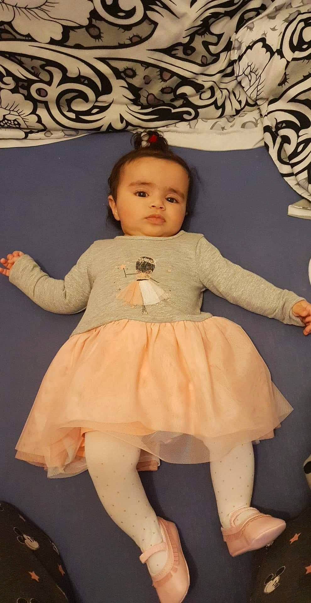 Maram participe au concours pour gagner de l'argent avec cette photo : baby_toddler_clothing, cheek, clothing, day_dress, dress, eye, face, fashion, hairstyle, human, iris, neck, one_piece_garment, organ, outerwear, person, pink, skin, sleeve, standing