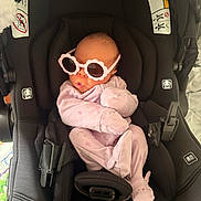 Amoura joined the competition — help win amazing prizes! baby, infant, car_seat, sunglasses, pink_clothing, cute, newborn, child, seatbelt, indoor, accessory, pout, fashion, headwear, soft_lighting, portrait, baby_clothes, resting, baby_girl, adorable