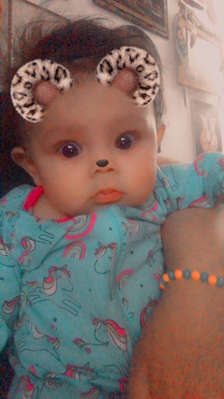 Aviana is registered to the contest to win money with this photo: baby, baby_toddler_clothing, cap, cheek, child, costume_hat, eye, eyebrow, eyelash, forehead, hair, headpiece, iris, lip, nose, person, pink, skin, sleeve, textile