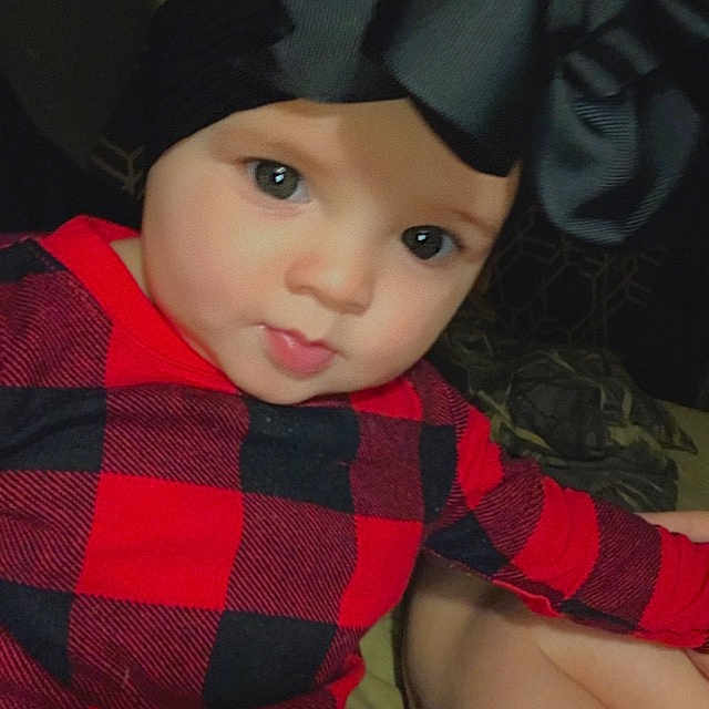 Brooklinn Rae is registered to the contest to win money with this photo: black_hair, cap, carmine, child, costume_hat, doll, eye, fashion_accessory, flash_photography, hat, lip, magenta, one_piece_garment, pattern, personal_protective_equipment, pink, plaid, sleeve, tartan, toy