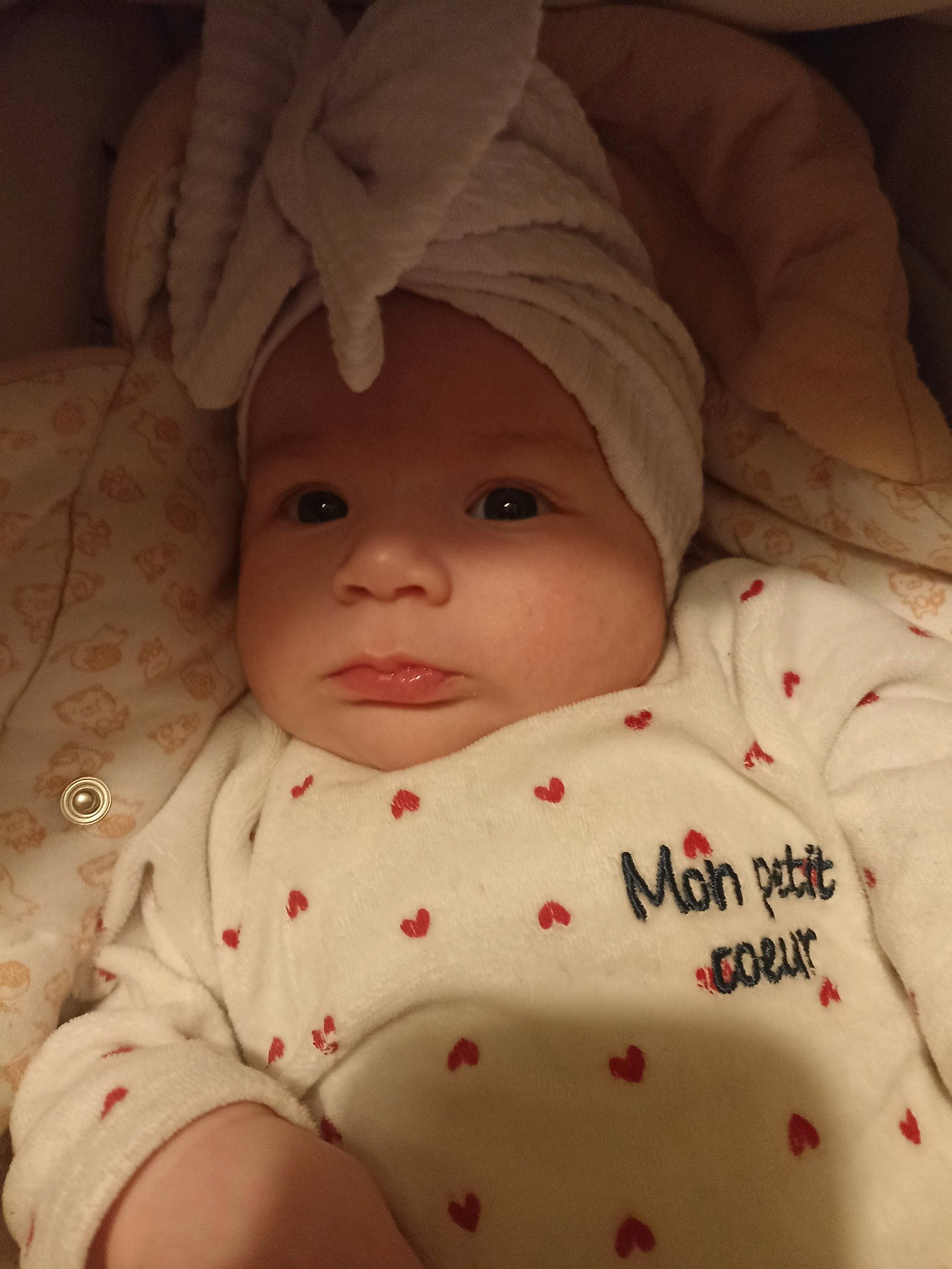 Charlotte participe au concours pour gagner de l'argent avec cette photo : baby, baby_sleeping, baby_toddler_clothing, cheek, chin, comfort, eye, eyebrow, face, hat, head, headgear, headwear, lip, mouth, nose, outerwear, person, skin, sleeve