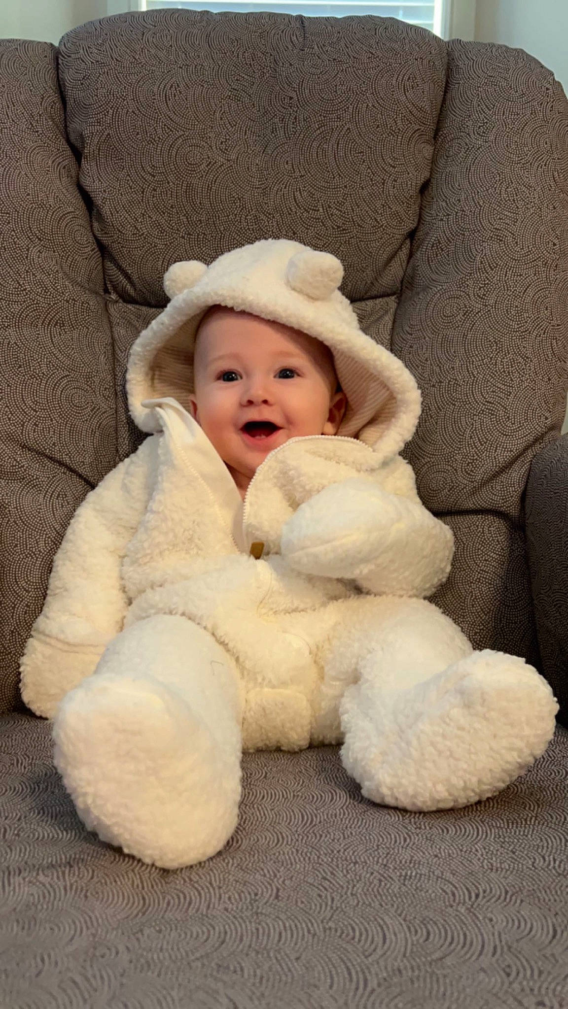 Cash Baber is registered to the contest to win money with this photo: baby, baby_toddler_clothing, cap, cheek, child, comfort, eye, fur, fur_clothing, happy, headwear, linens, natural_material, person, portrait_photography, sitting, sleeve, smile, toddler, winter