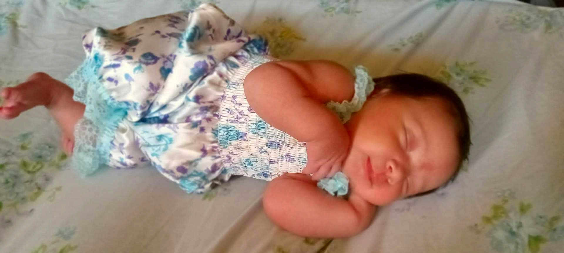 Ava Sherman joined the competition — help win amazing prizes! baby, bed, blanket, child, clothing, cute, fabric, face, feet, hands, infant, newborn, pattern, peaceful, person, portrait, relaxation, rest, sleeping, soft