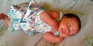 Ava Sherman is registered to the contest to win money with this photo: arm, baby, bed, clothing, cute, fabric, face, floral, foot, hand, infant, lying_down, newborn, pattern, peaceful, person, rest, skin, sleeping, soft