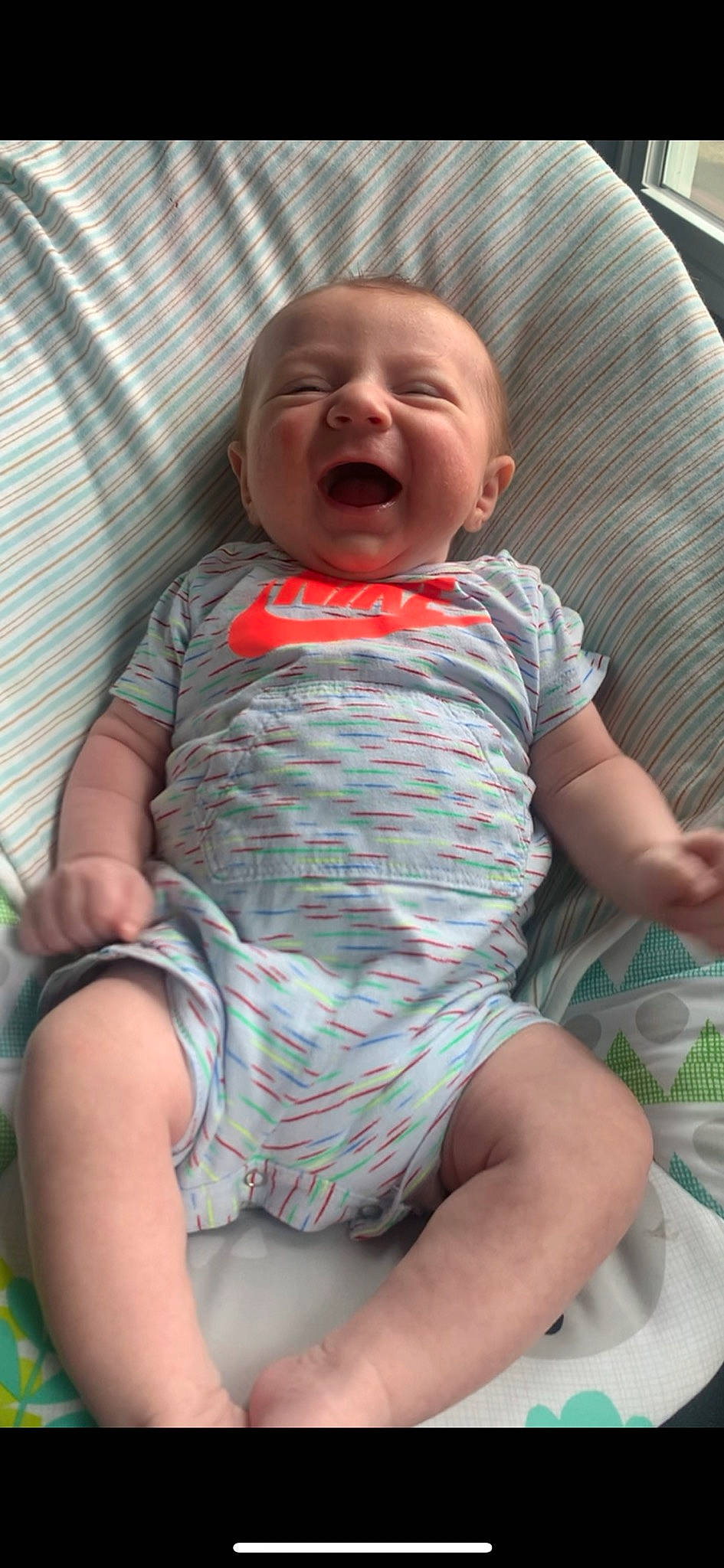 Benson is registered to the contest to win money with this photo: baby, baby_toddler_clothing, cheek, comfort, eye, facial_expression, finger, hand, head, iris, leg, lip, mouth, nose, organ, person, skin, sleeve, smile, textile