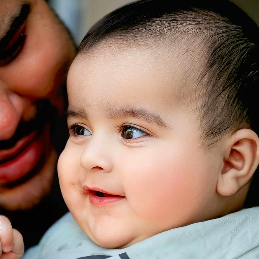 Kazim is registered to the contest to win money with this photo: adult, baby, cheeks, child, closeup, clothing, cute, expression, eyes, face, family, happy, indoor, joy, love, person, portrait, skin, smiling, toddler