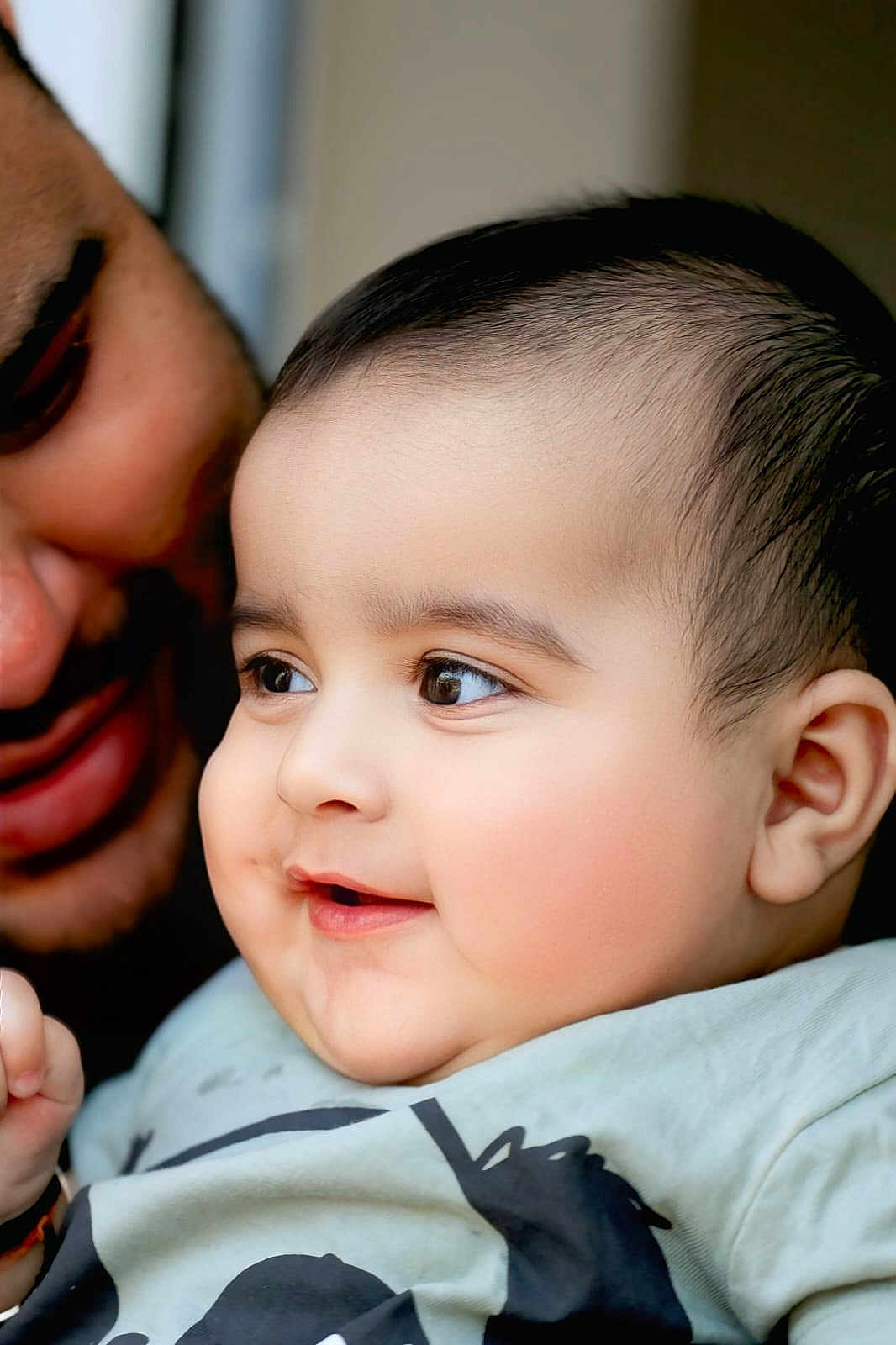 Kazim is registered to the contest to win money with this photo: baby, child, smiling, face, closeup, adult, love, joy, cheeks, eyes, portrait, skin, person, toddler, cute, happy, expression, indoor, clothing, family