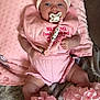 Myla joined the competition — help win amazing prizes! baby, infant, pink_clothing, headband, bow, pacifier, blanket, ruffles, legs, cute, indoors, soft_texture, clothing, person, lying_down, beads, comfort, toddler, face, child