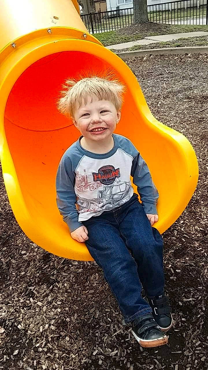 Kayden joined the competition — help win amazing prizes! child, city, fun, happy, joy, leisure, outdoor_play_equipment, person, play, playground, playground_slide, public_space, recreation, smile, toddler, yellow