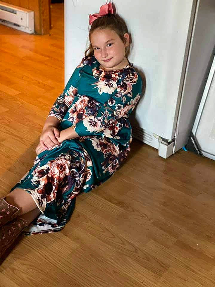 Aleah joined the competition — help win amazing prizes! baby_toddler_clothing, comfort, fashion_design, floor, flooring, hairstyle, hardwood, head, human_leg, joy, knee, long_hair, neck, person, sleeve, smile, sock, thigh, toddler, trunk