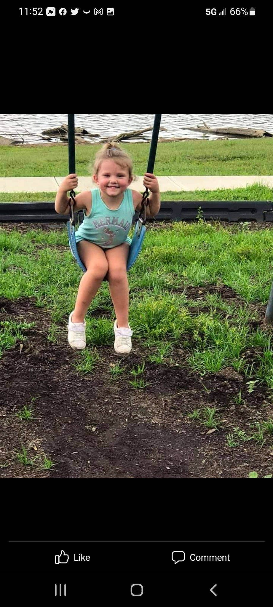 Alyssa is registered to the contest to win money with this photo: blond, electric_blue, fun, grass, happy, human_leg, joy, knee, landscape, leisure, people_in_nature, person, plant, recreation, shorts, smile, soil, swing, t_shirt, thigh
