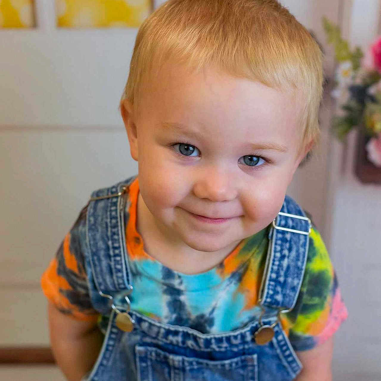 Westin is registered to the contest to win money with this photo: blonde, bodypart, boy, child, clothing, face, hair, happy, head, jeans, male, mouth, pants, person, photography, plant, portrait, pottedplant, smile, vest