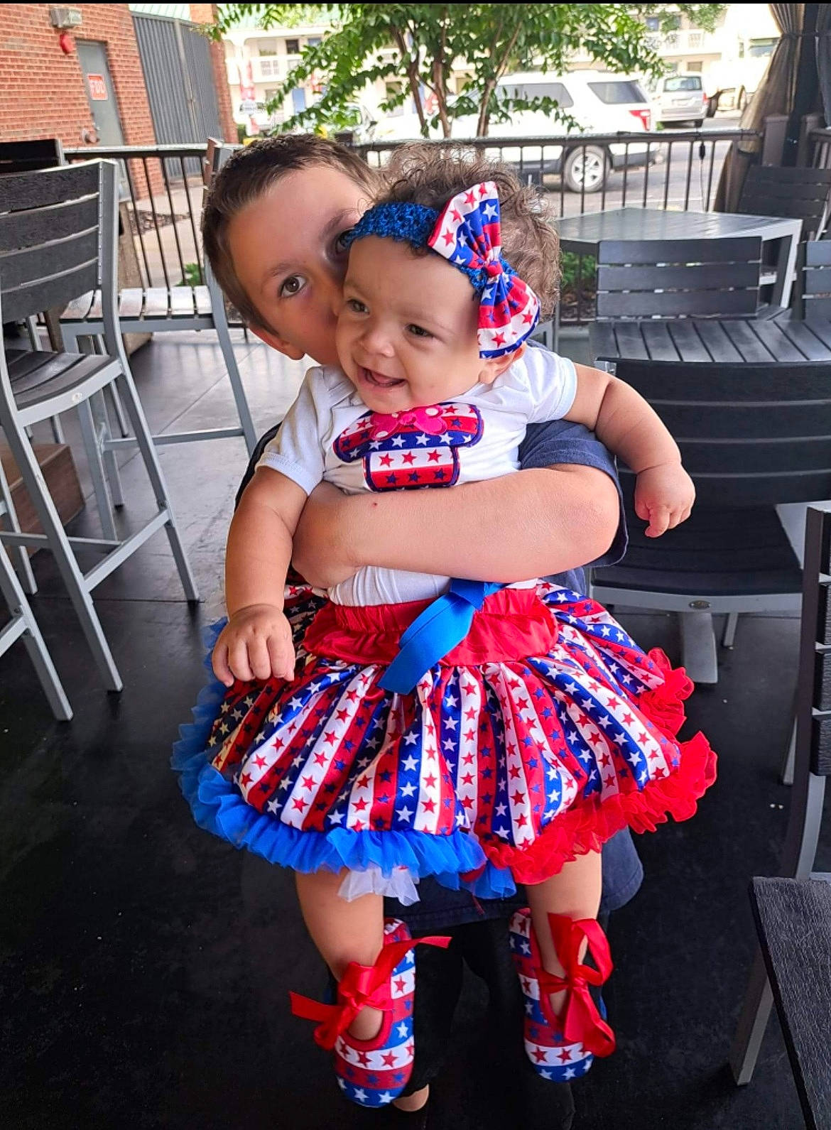 Gabriella is registered to the contest to win money with this photo: baby, baby_toddler_clothing, chair, child, costume, day_dress, design, dress, electric_blue, event, fun, happy, headwear, joy, leisure, pattern, person, pink, plaid, purple