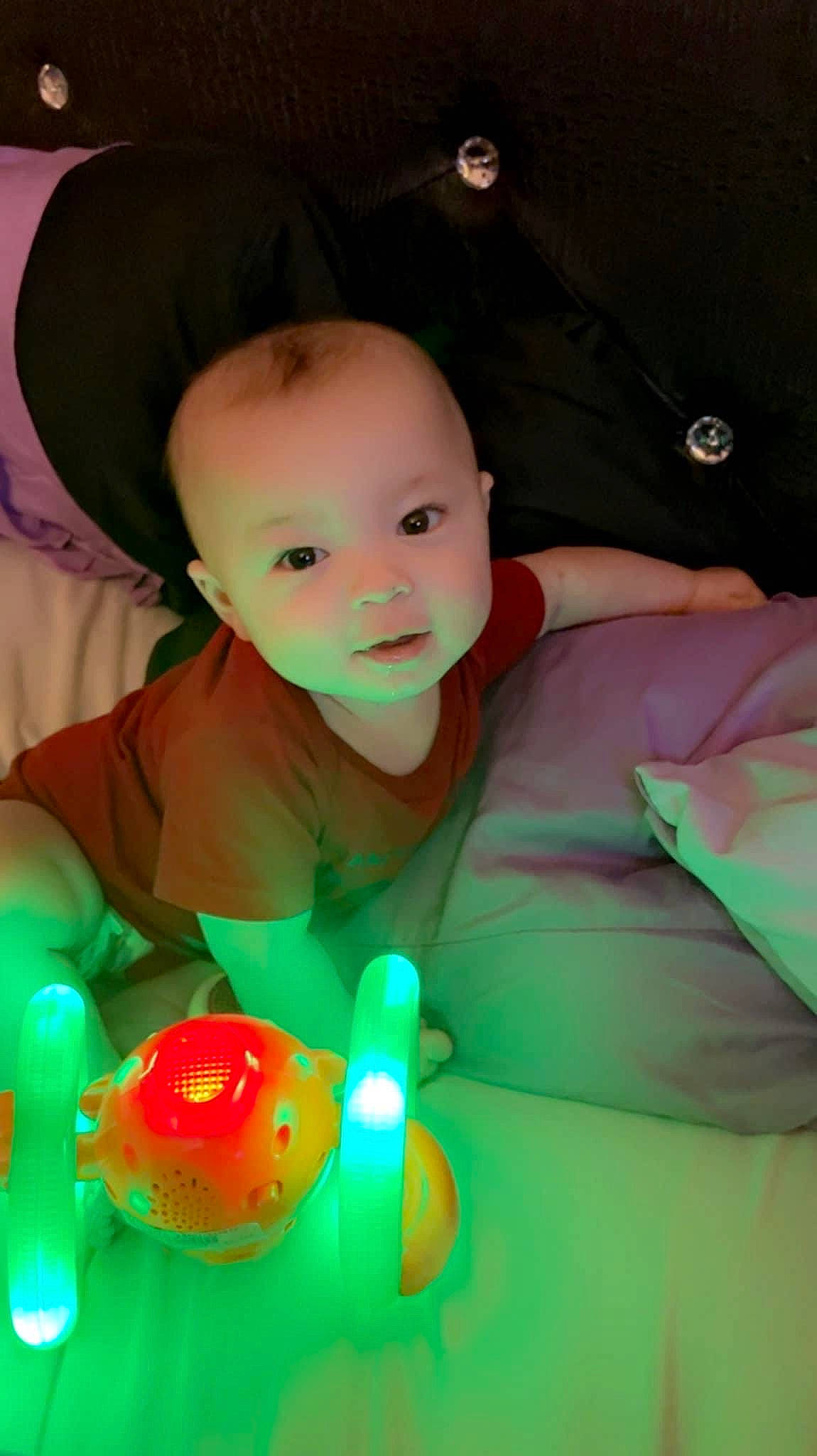 Gabriel is registered to the contest to win money with this photo: baby, baby_products, child, event, fun, glass, grass, hat, magenta, person, play, room, sitting, skin, smile, table, toddler, tree