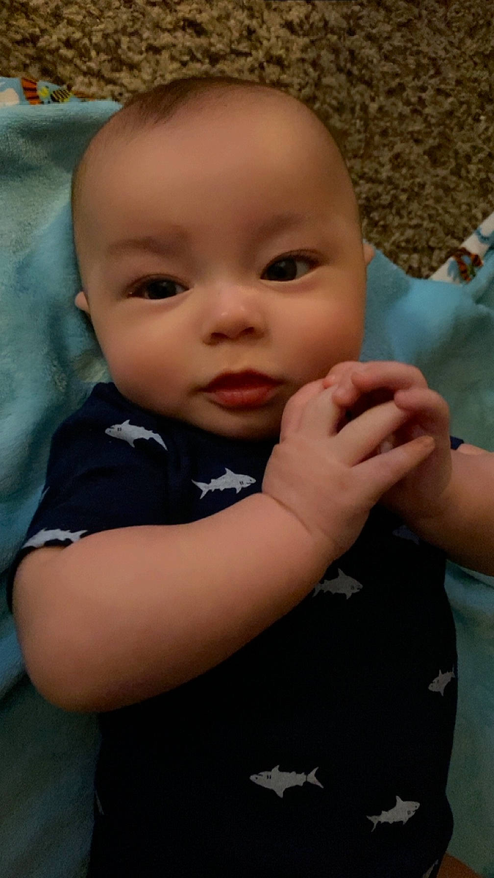 Gabriel is registered to the contest to win money with this photo: arm, baby, baby_toddler_clothing, cheek, child, eye, finger, fun, gesture, hand, happy, head, iris, nail, nose, person, skin, sleeve, t_shirt, thumb