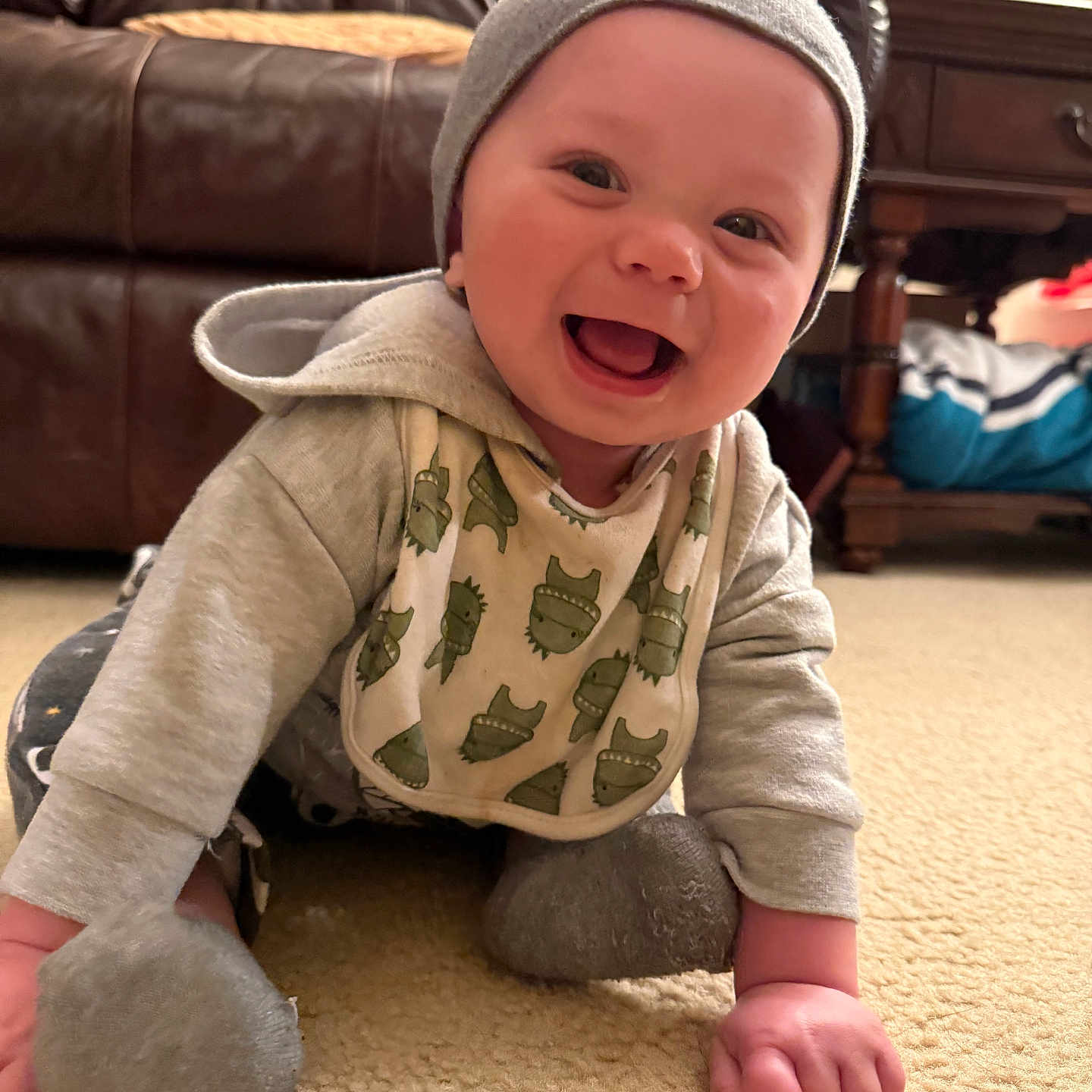 Malachai is registered to the contest to win money with this photo: architecture, baby, babylaughing, bonnet, building, cap, clothing, couch, crawling, face, furniture, happy, hat, head, indoors, livingroom, person, photography, portrait, sitting